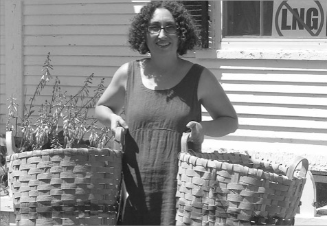 Maria Reccia holding Scale Baskets